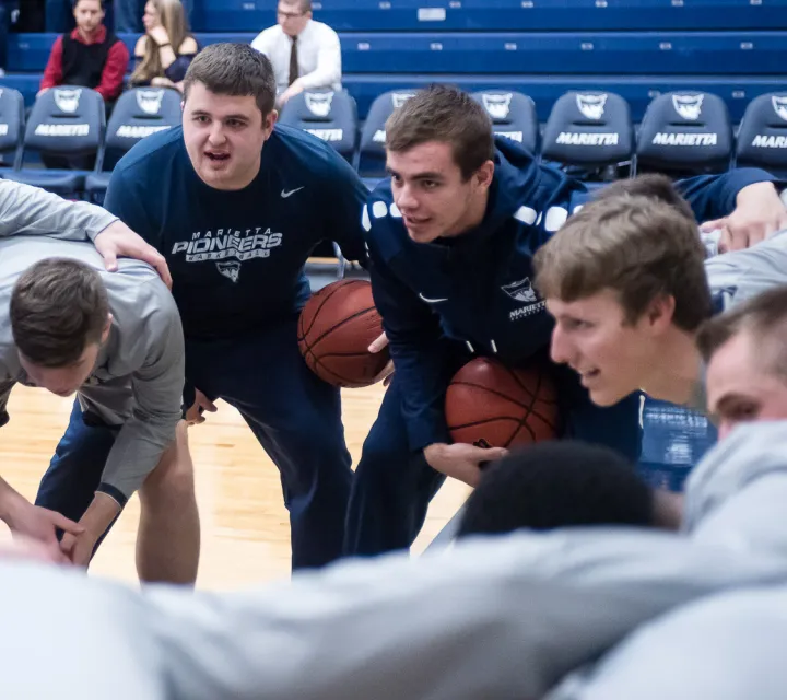 Noah helps to psych up the Marietta College basketball team