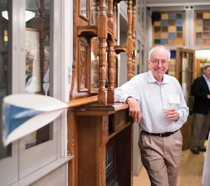 Frank Wright '67 stands by the oar he used during the 1966 Dad Veil Regatta