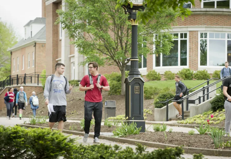 Two Marietta College Students walk down Christy Mall