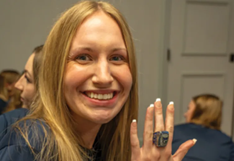 Erin Hahn ’23 sports the ring that members of the 2022-23 women’s basketball team received for reaching the NCAA Division III Sweet 16.