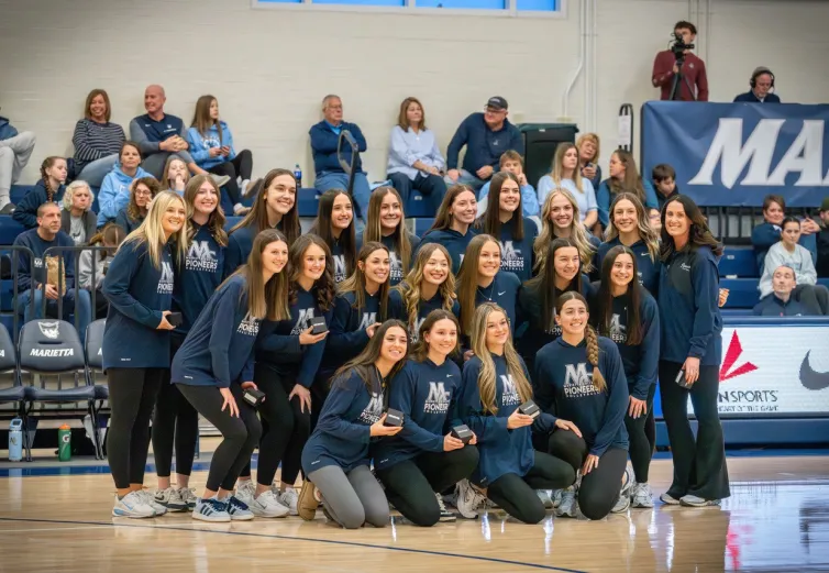 Volleyball receiving OAC championship rings