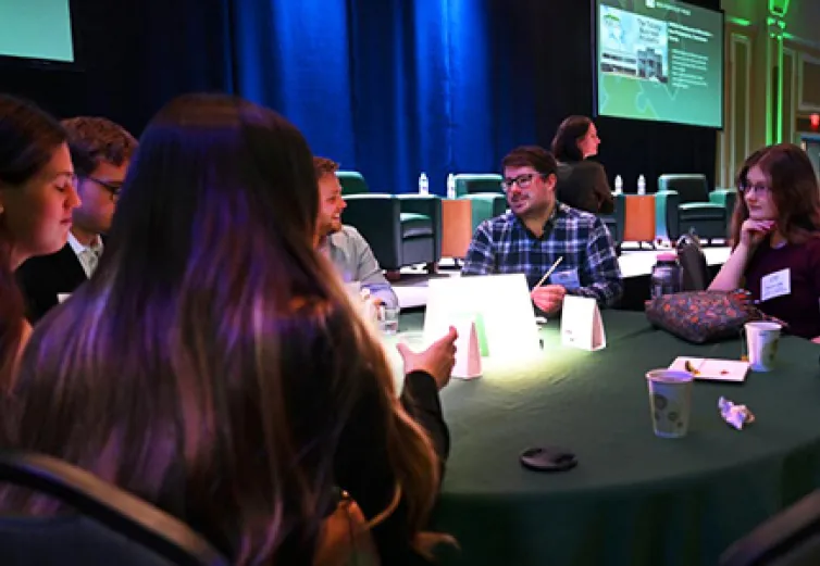 Student and advisor at a conference