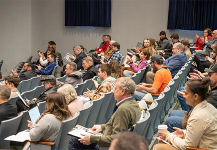 Attendees in the McDonough Center Auditorium attending the The Future of Appalachian Ohio's Timber Industry symposium