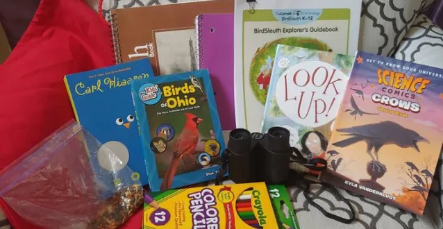 Books, crayons and other school supplies on a table