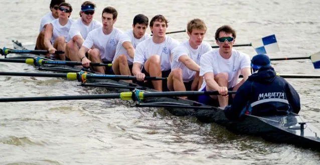 men rowing on the river