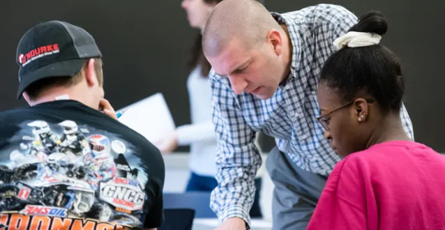 Dr. Kevin Pate helping students