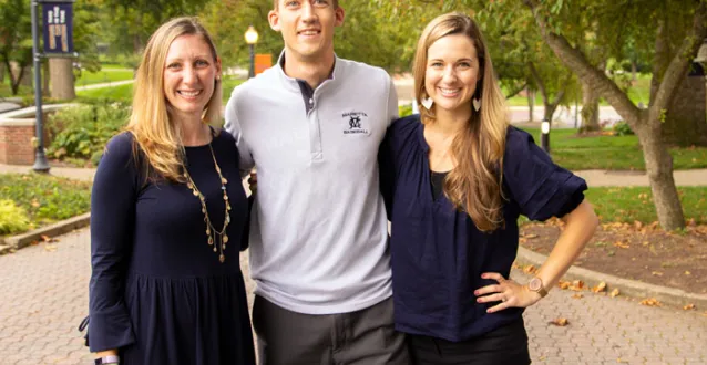 Three people standing together