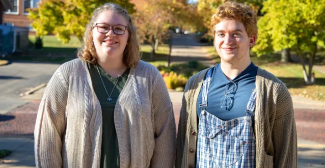 Two students posing on campus