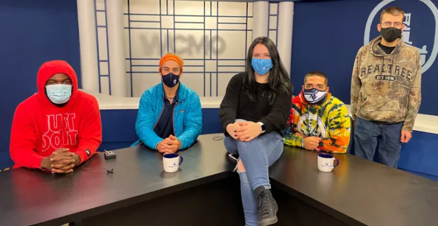 Masked students in the TV studio