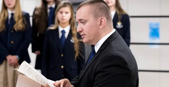 Music director speaking with students