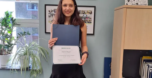 Haille Rogers holding certificate