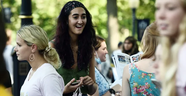 Auva Zandi outside on The Christy Mall with other students