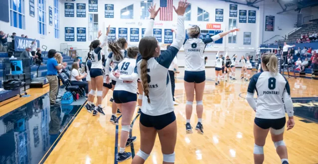 Volleyball players celebrating