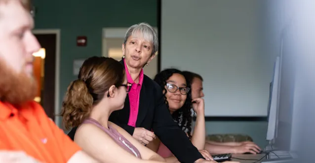 Grace Johnson speaking with students