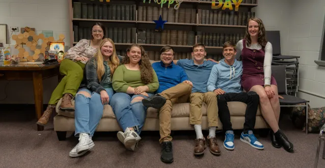 Biochemistry students sitting on a couch