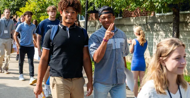 Students smiling, walking