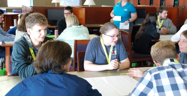 High school students sitting at a table