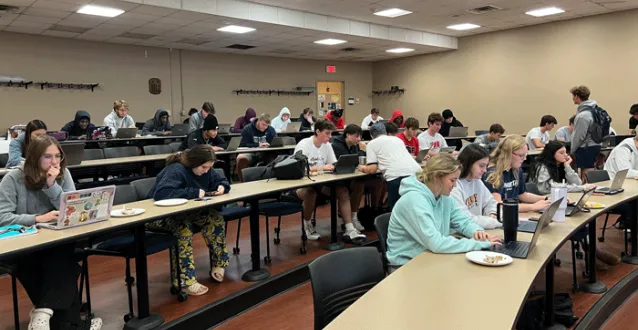 Students eating breakfast and registering for classes