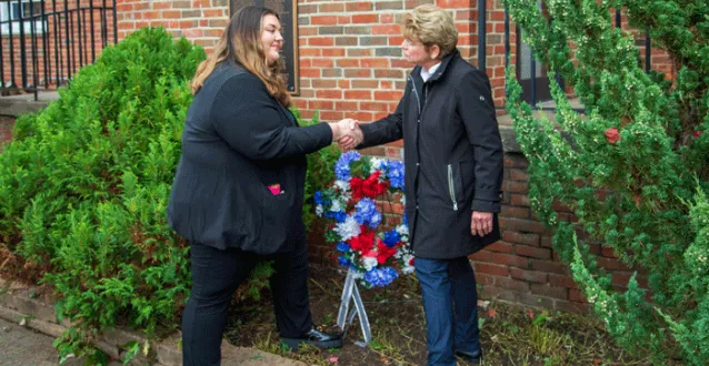 Maria Cipro and President Drugovich shake hands