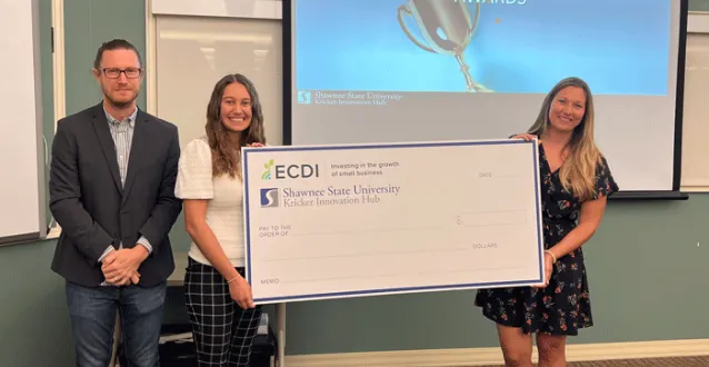 Lillian Franchino holding a big check