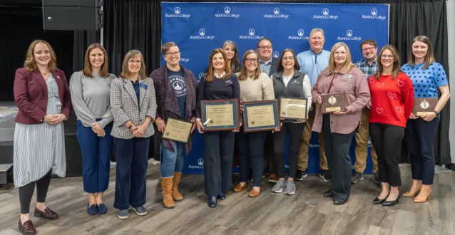 Award winners pose with awards