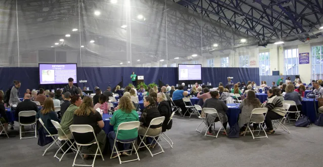 Hundreds of attendees sit at circular tables in the Dyson Baudo Recreation Center for the 2026 Nonprofits LEAD Capacity Building Conference