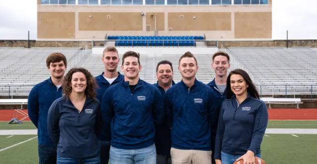 Students with Professor Smith at Don Drumm Stadium