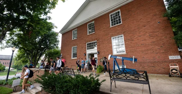 Students in front of the Brown Petroleum Building