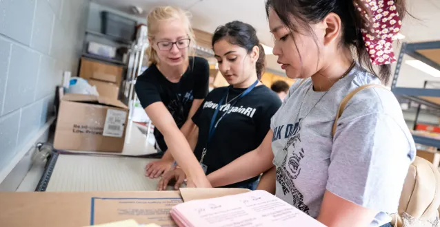 Female students sorting books