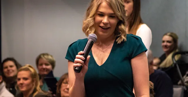 April Bartenschlag speaks during the December 2018 graduation