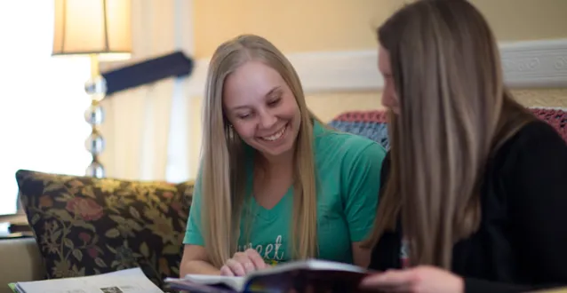 Two femail students studying in Fayerweather Hall