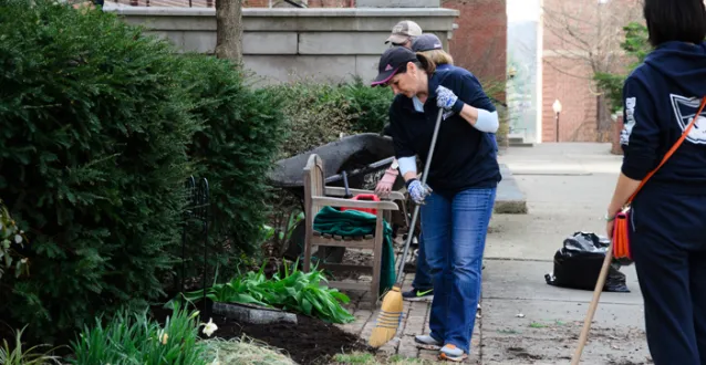 Employees and students cleaning campus