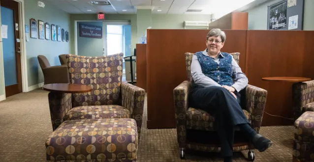 Debbie Egolf sitting in the Worthington Center