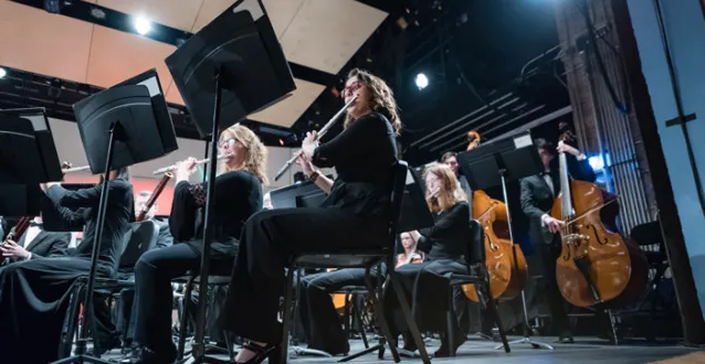 Students performing during band concert at Peoples Bank Theatre