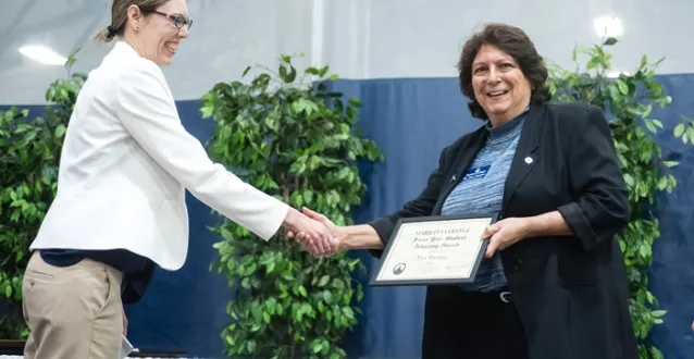Tina Thomas receiving an award for advising during Founders Day 2018