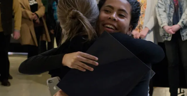 France Moise '20 hugs Professor Beth Nash