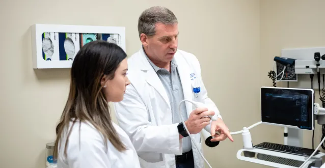 Dr. John Grosel demonstrates how to use an ultrasound machine