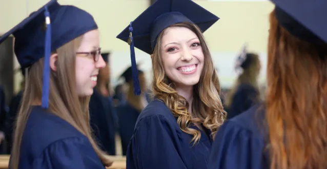 PA students smile and laugh during the graduation ceremony