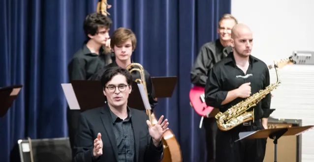 Instructor Jordan Reed leading the Jazz Combo during a concert