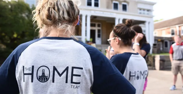 Students wearing HOME T-shirts