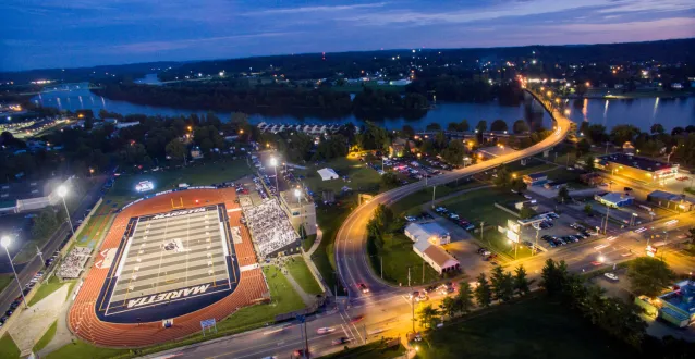 Night aerial photo of Don Drumm Stadium with the lights on