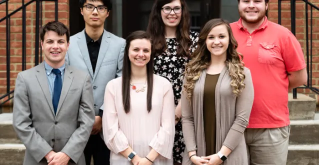 Six Marietta students standing in front of McDonough steps