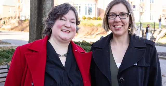 McCoy Professors Lynn Bostrom and Nicole Livengood outside of Andrews Hall