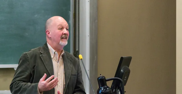 Mark Sibicky lecturing at a podium