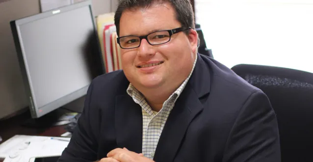 Jarrett Stull sitting at his desk