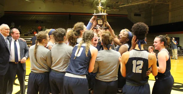 Holding the OAC trophy