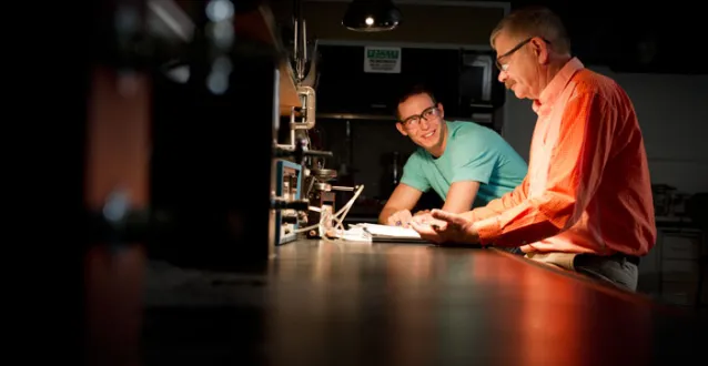 Professor and student working together in a lab