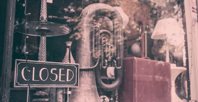 old tuba in a storefront