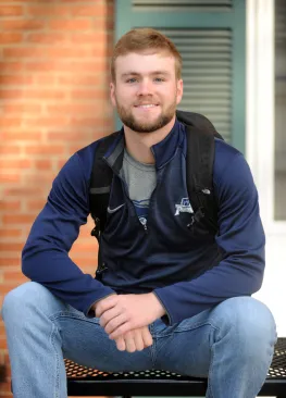 A Marietta College accounting major sitting outside