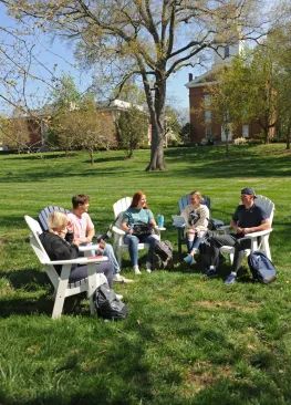 Marietta College students sitting outside and talking